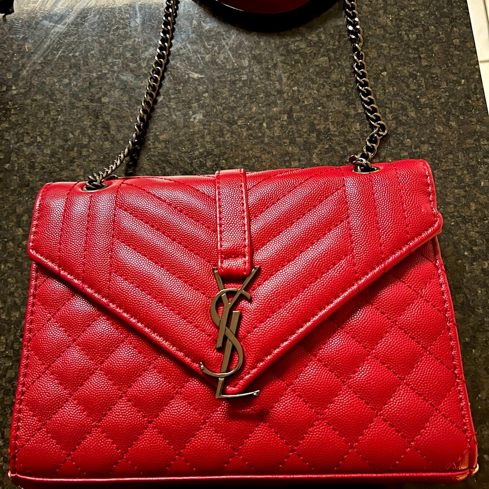 Envelope leather crossbody bag Saint Laurent Red in Leather